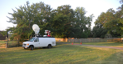 TV news van at the Calvert House site.