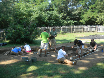 Students working on the foundation and mapping the location of the discovered cellars.