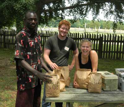 Abdoulie Sey, Stephen Warner and Sarah Shipley prepare five more bags of artifacts (all from one stratum) from the midden for transport to the lab.