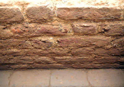 Brick cellar wall illustrating Flemish Bond pattern.