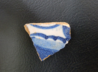 Blue-decorated sherd of tin glazed earthenware