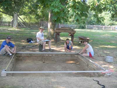 Jerry Warner, Kyle McGrath, Irene Posey and Jean Drzyzgula map the possible cellar hole. 