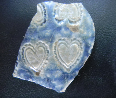 Large piece of Rhenish Blue and Gray stoneware with heart design..
