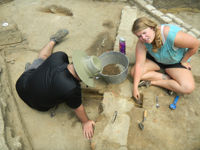  John Young and Shannon Vandever excavate the feature over the foundation..