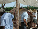 Masons at work on the arch and the surrounding walls