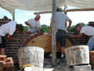 Building an arch goes quickly with four masons and a wood form