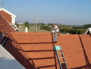 Berkley at work on the roofing tiles