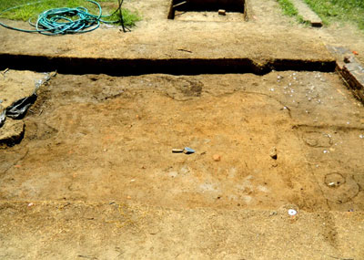 Large, rectangular feature which might hide a chimney base.