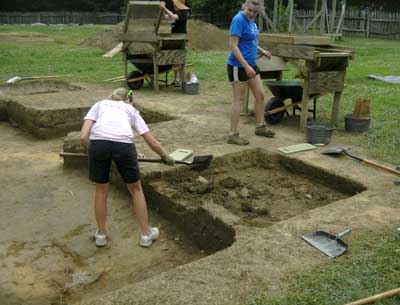 Emily Burr continue the excavation of the last driveway square.