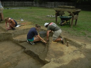 Rebecca Matthews and Kyle Prinkey excavate features in the area of the oil tank.