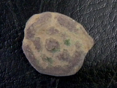 Small copper alloy button decorated with a Tudor Rose.